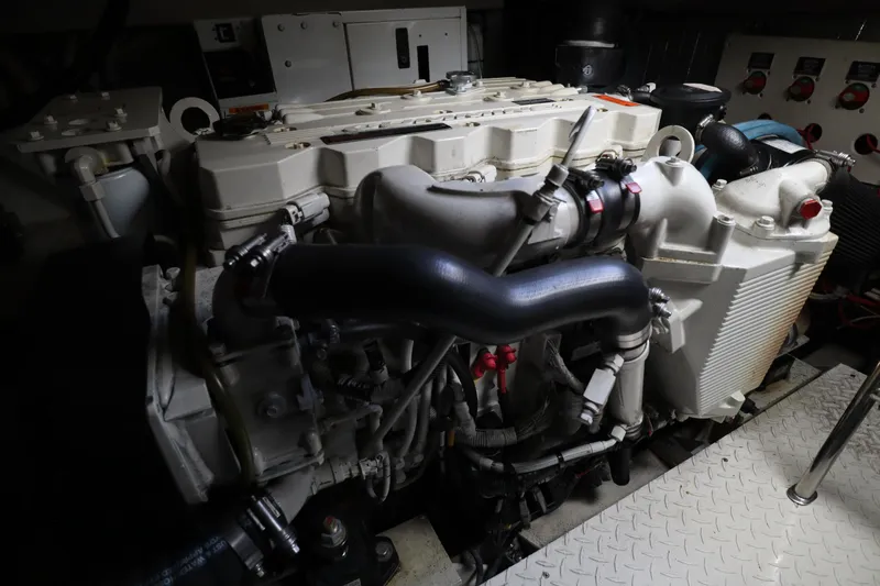  Yacht Photos Pics Engine compartment of a 2006 Rampage 33 Express boat, showcasing detailed machinery.