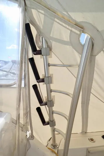  Yacht Photos Pics Interior view of 2006 Rampage 33 Express boat with rod holders and canopy.