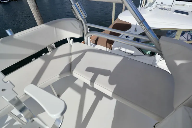  Yacht Photos Pics 2006 Rampage 33 Express boat seating area with metal railings.