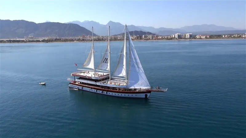 My Dream Yacht Photos Pics Custom Manavgat GT 457 yacht sailing near coastal city, 2009 model.