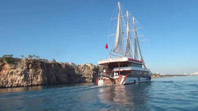 My Dream Yacht Photos Pics Custom Manavgat GT 457 yacht sailing near rocky coastline, 2009 model.