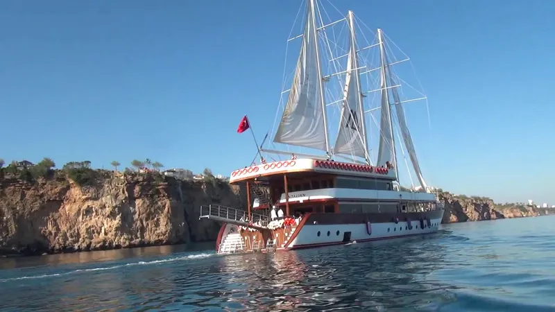 My Dream Yacht Photos Pics Custom Manavgat GT 457 yacht sailing near rocky cliffs, 2009 model.