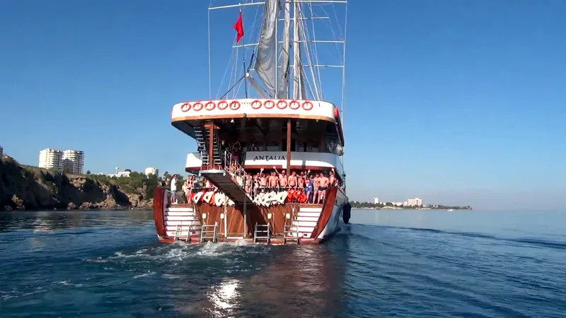 My Dream Yacht Photos Pics Custom Manavgat GT 457 boat sailing near coastal cliffs, 2009 model.