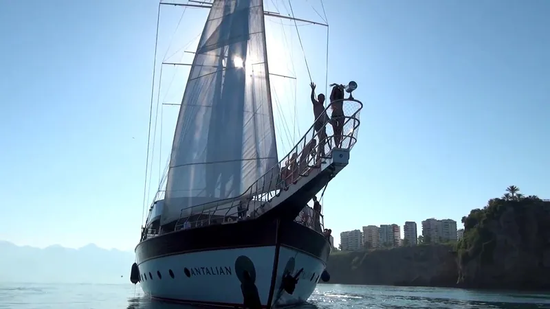 My Dream Yacht Photos Pics Sailing yacht Antalyan Custom Manavgat GT 457, 2009, on calm waters near coastal cliffs.