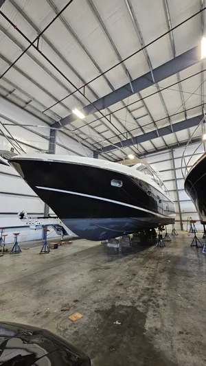 Far Niente Yacht Photos Pics 2012 Sunseeker Manhattan 53 yacht in a spacious indoor storage facility.