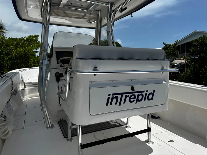  Yacht Photos Pics 2015 Intrepid 327i Open boat interior with helm and seating.