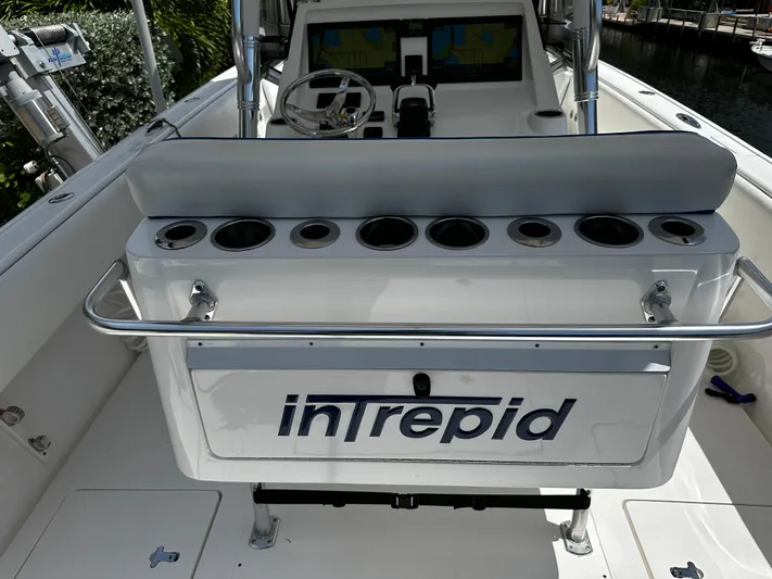  Yacht Photos Pics 2015 Intrepid 327i Open boat interior with rod holders and steering console.