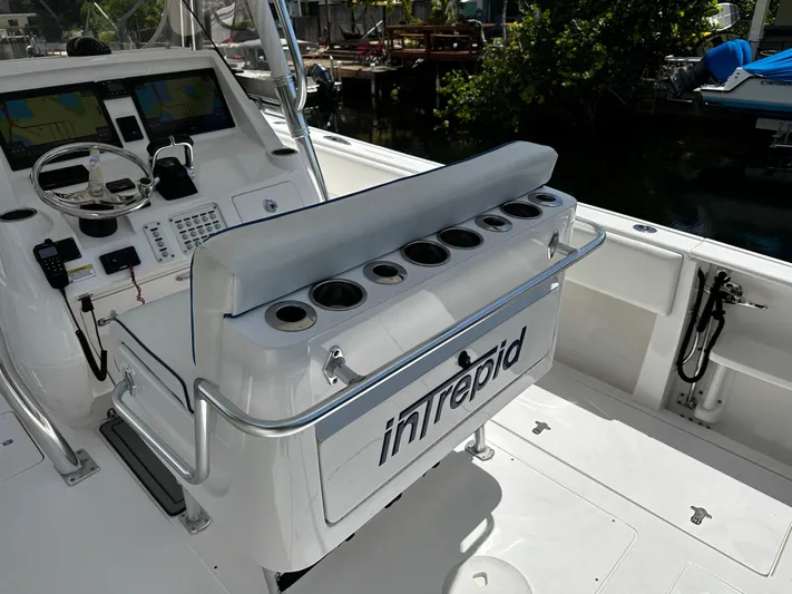  Yacht Photos Pics 2015 Intrepid 327i Open boat cockpit with helm station and rod holders.