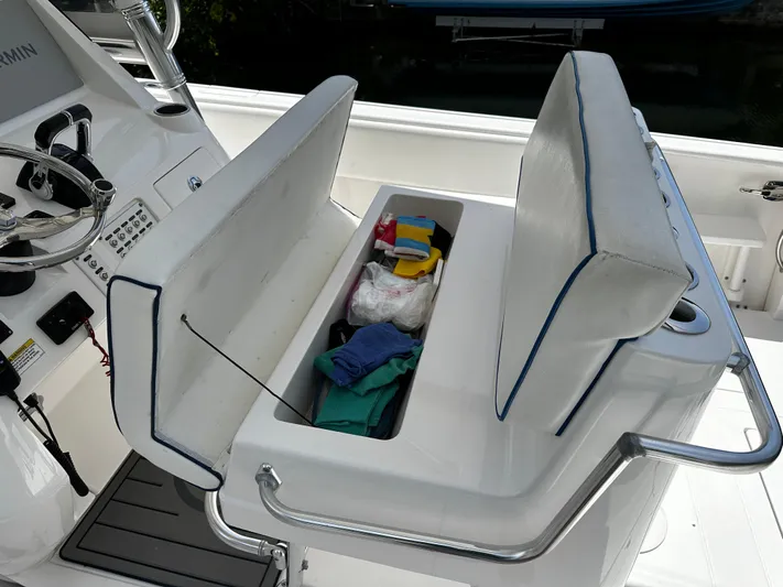  Yacht Photos Pics 2015 Intrepid 327i Open boat with open storage compartment under seat.