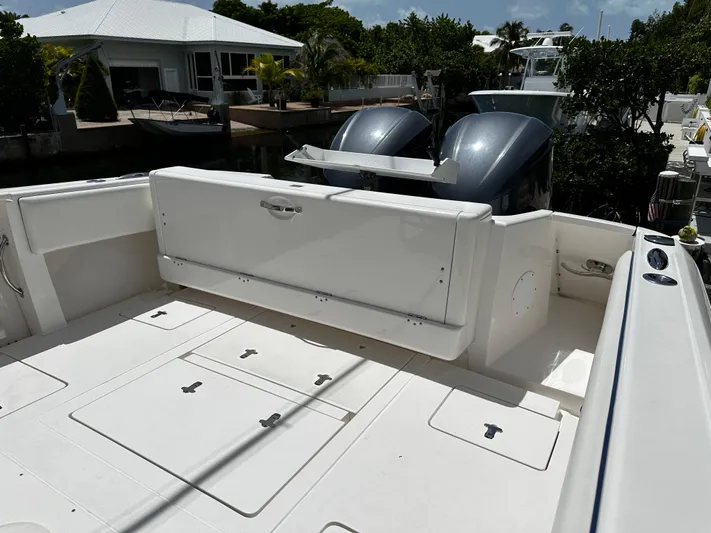  Yacht Photos Pics 2015 Intrepid 327i Open boat with dual outboard engines docked.