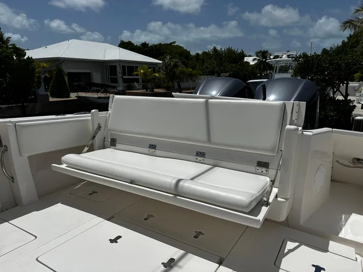  Yacht Photos Pics 2015 Intrepid 327i Open boat with foldable bench seat and dual outboard motors.