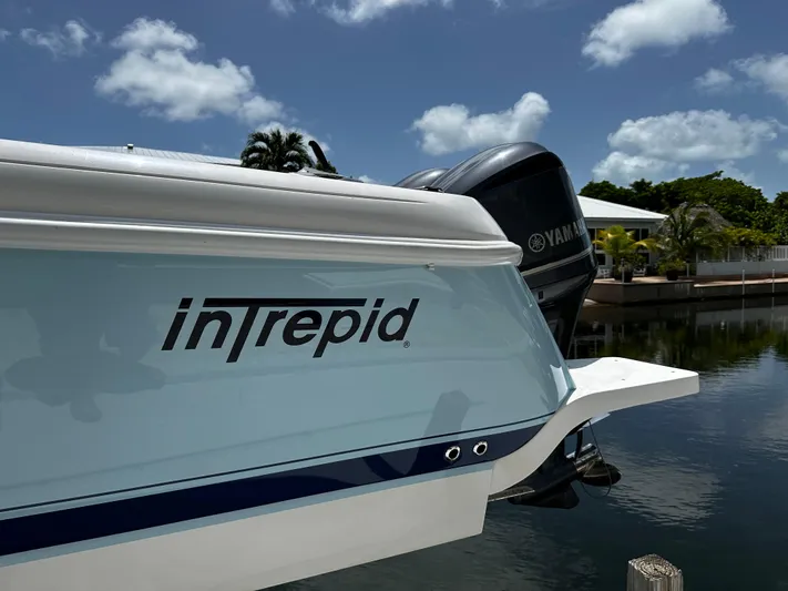  Yacht Photos Pics 2015 Intrepid 327i Open boat docked with Yamaha outboard motor.