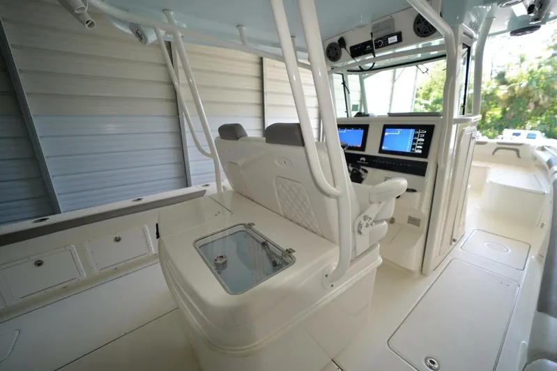  Yacht Photos Pics 2018 World Cat 320 CC boat interior with modern helm and seating.
