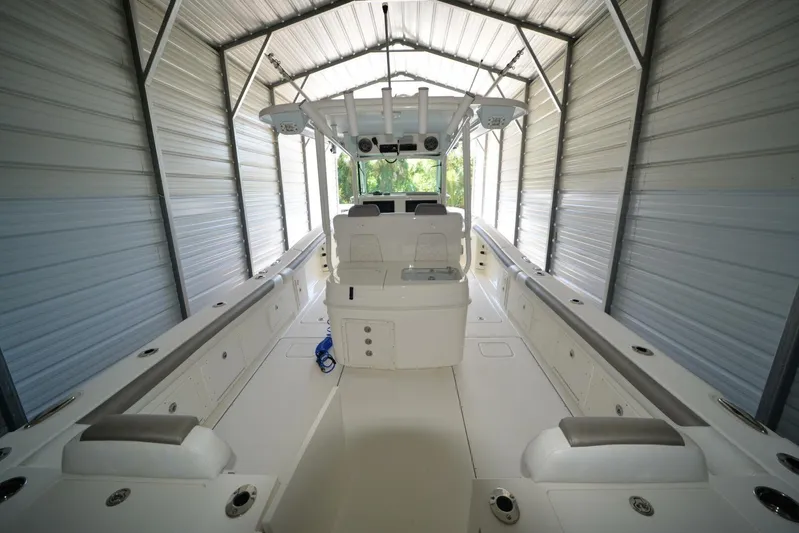  Yacht Photos Pics 2018 World Cat 320 CC boat interior in a metal storage shed.