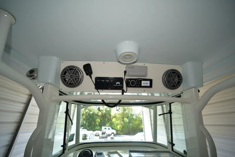  Yacht Photos Pics 2018 World Cat 320 CC boat interior with speakers and electronic controls.
