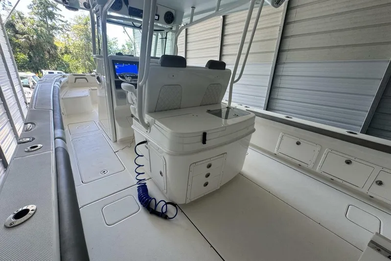  Yacht Photos Pics 2018 World Cat 320 CC boat interior with helm station and seating.