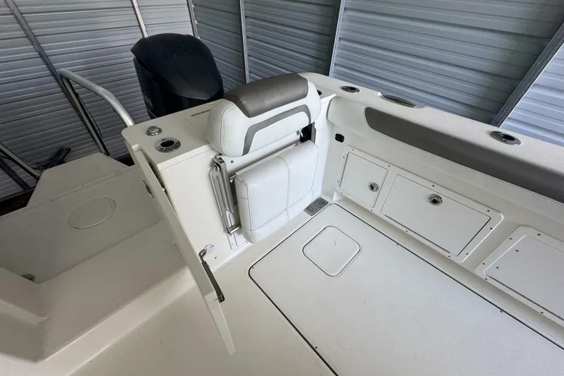  Yacht Photos Pics 2018 World Cat 320 CC boat interior with seating and storage compartments.