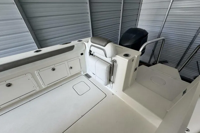  Yacht Photos Pics 2018 World Cat 320 CC boat interior with storage compartments and seating.