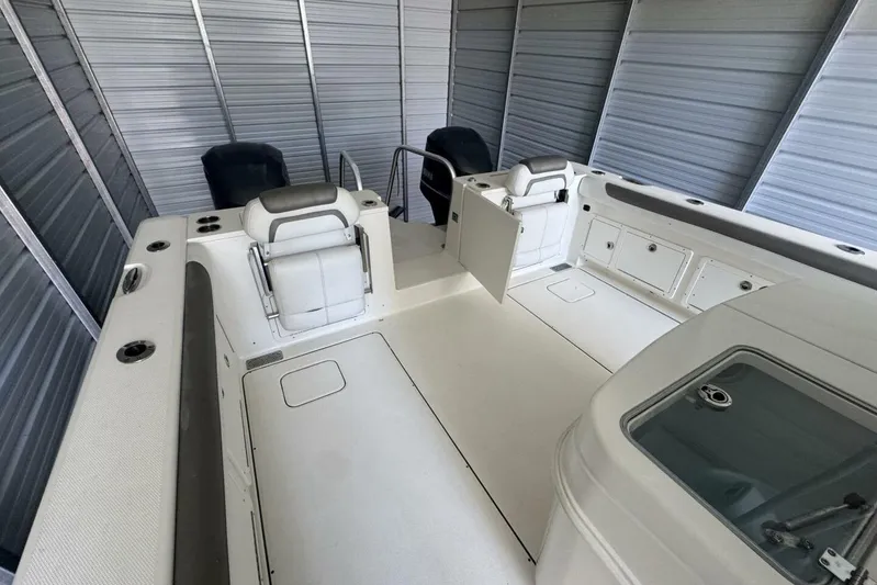 Yacht Photos Pics 2018 World Cat 320 CC boat interior with seating and storage compartments.