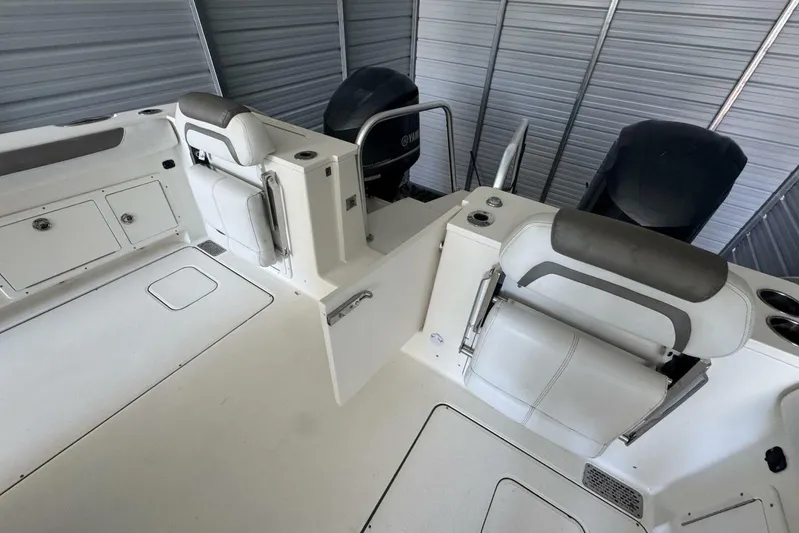  Yacht Photos Pics 2018 World Cat 320 CC boat interior with seating and storage compartments.