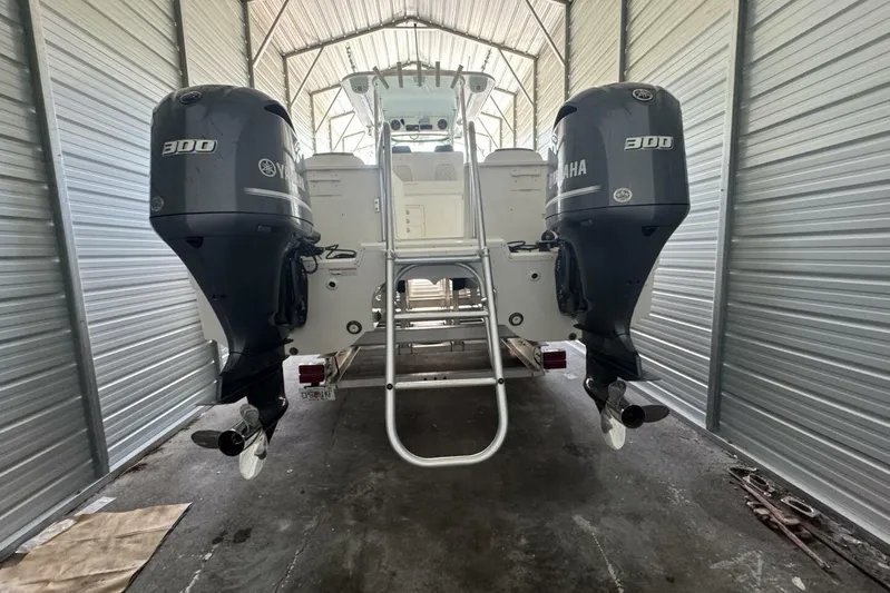  Yacht Photos Pics 2018 World Cat 320 CC with twin Yamaha 300 engines in a metal storage unit.