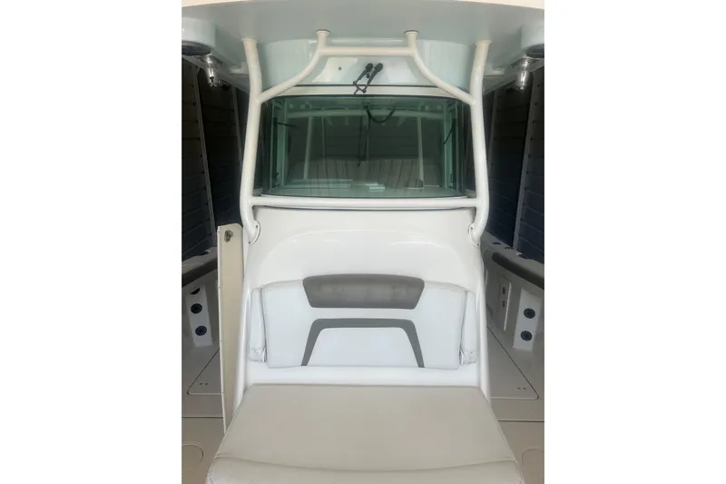  Yacht Photos Pics 2018 World Cat 320 CC boat interior with seating and console view.