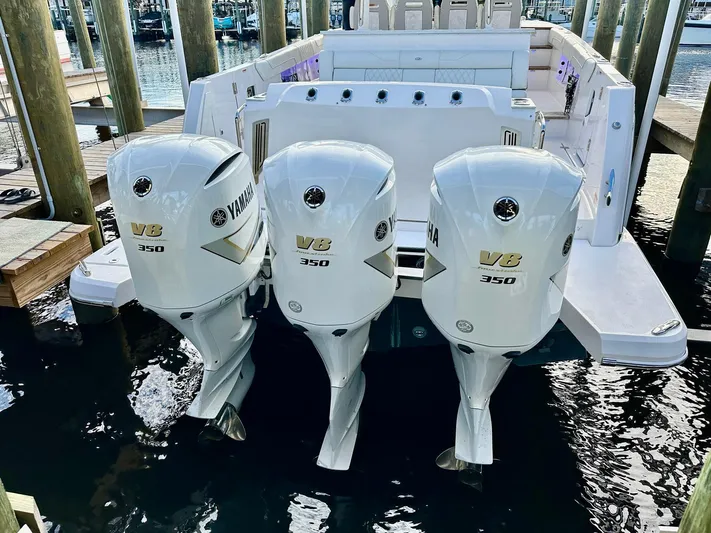  Yacht Photos Pics 2021 Regal 38 SAV boat with triple Yamaha V8 350 engines at dock.