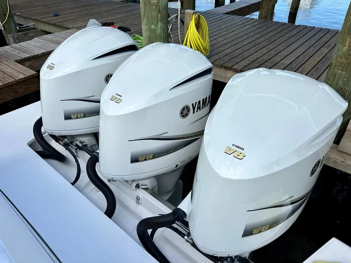  Yacht Photos Pics Triple Yamaha V8 outboard engines on 2021 Regal 38 SAV boat at dock.