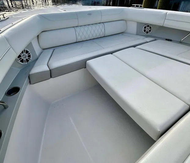  Yacht Photos Pics Luxurious seating area on 2021 Regal 38 SAV boat with white upholstery.