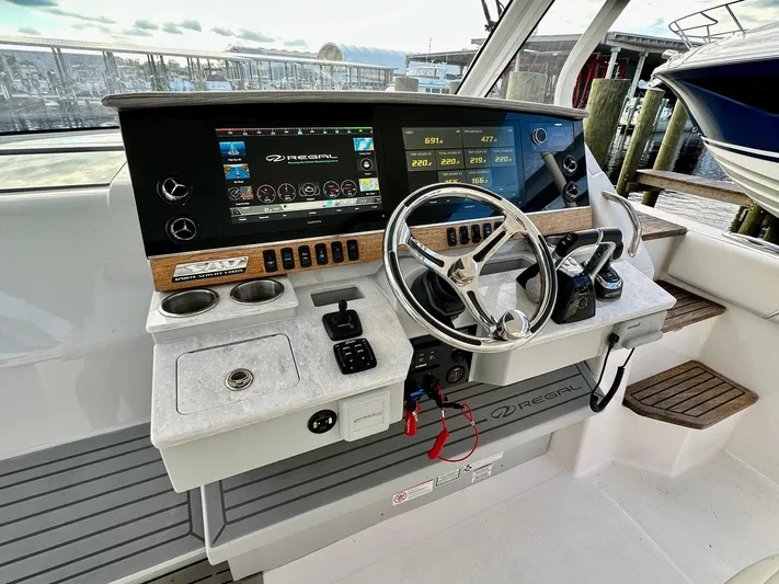  Yacht Photos Pics 2021 Regal 38 SAV boat helm with modern controls and navigation displays.