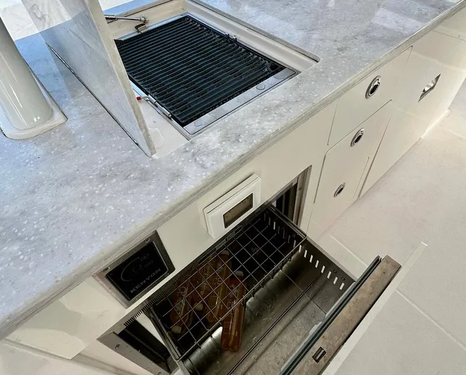  Yacht Photos Pics 2021 Regal 38 SAV yacht kitchen with grill and storage drawers.