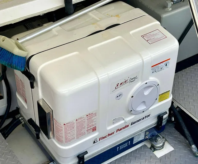  Yacht Photos Pics Fischer Panda generator on 2021 Regal 38 SAV boat, white casing, compact design.