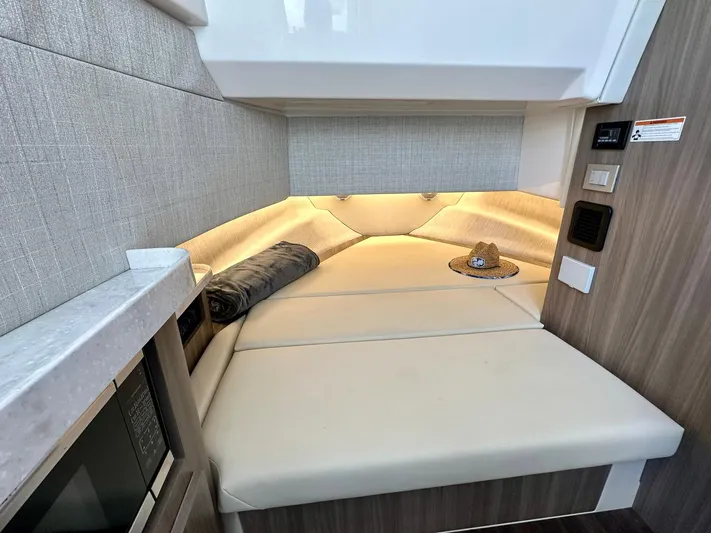  Yacht Photos Pics Luxurious interior cabin of 2021 Regal 38 SAV boat with cozy seating.