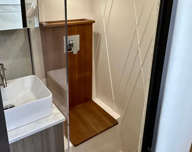  Yacht Photos Pics 2021 Regal 38 SAV bathroom with modern shower and sink design.