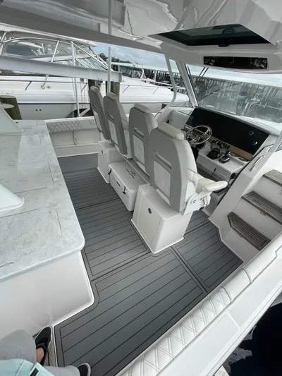  Yacht Photos Pics 2021 Regal 38 SAV boat interior with modern seating and sleek design.