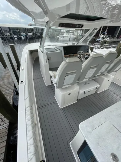  Yacht Photos Pics 2021 Regal 38 SAV boat interior with sleek seating and modern dashboard.
