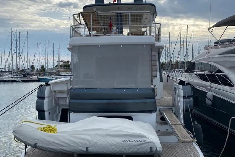  Yacht Photos Pics Azimut Magellano 66 yacht, 2019 model, docked at marina with covered tender.