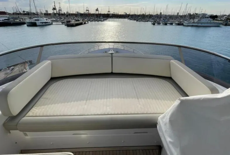  Yacht Photos Pics Luxurious seating area on 2019 Azimut Magellano 66 yacht, overlooking marina.