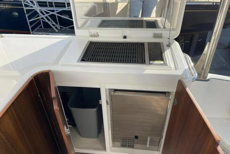  Yacht Photos Pics Outdoor kitchen on 2019 Azimut Magellano 66 yacht with grill and storage.