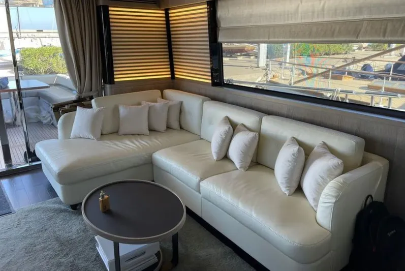  Yacht Photos Pics Luxurious interior of 2019 Azimut Magellano 66 yacht with elegant white sectional sofa.