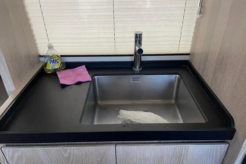  Yacht Photos Pics Modern kitchen sink in 2019 Azimut Magellano 66 yacht, with cleaning supplies.