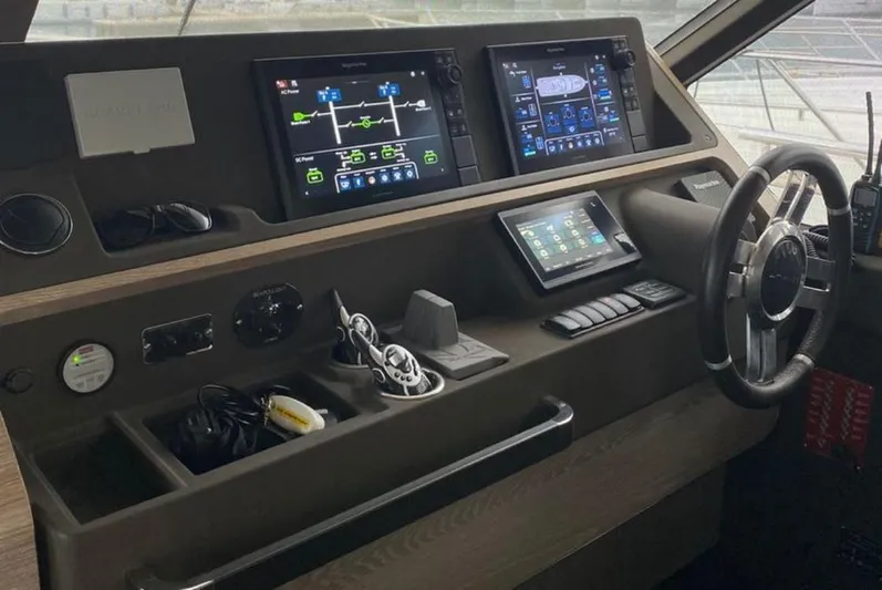  Yacht Photos Pics Control panel of 2019 Azimut Magellano 66 yacht with advanced navigation displays.