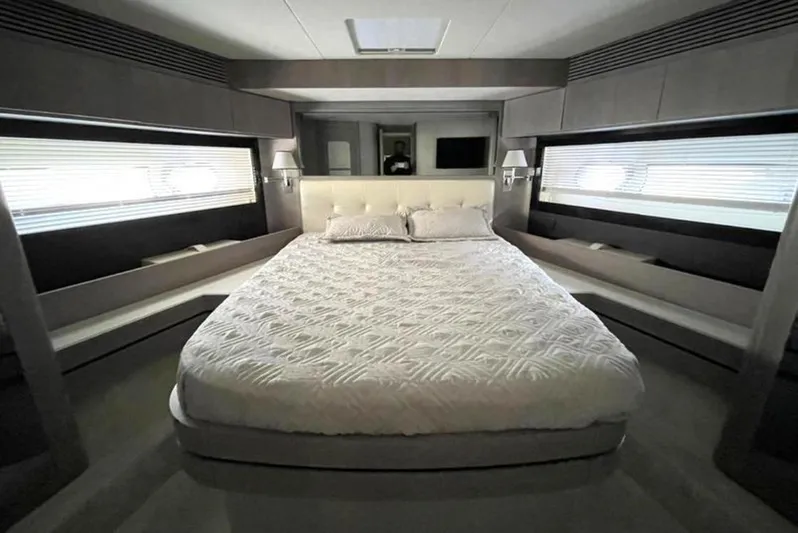  Yacht Photos Pics Luxurious bedroom interior of 2019 Azimut Magellano 66 yacht with elegant design.
