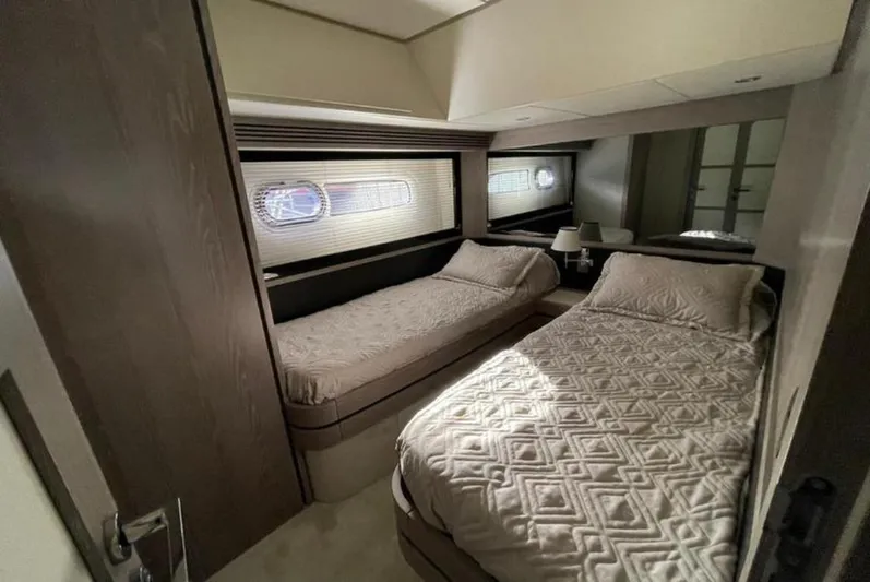  Yacht Photos Pics Luxurious twin bedroom in 2019 Azimut Magellano 66 yacht, featuring elegant bedding and modern design.