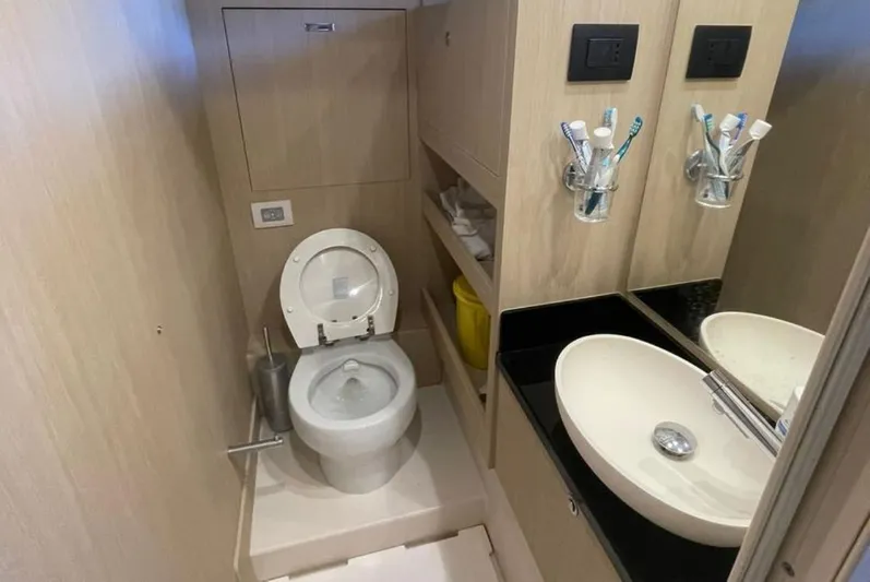  Yacht Photos Pics Bathroom interior of 2019 Azimut Magellano 66 yacht with modern fixtures and amenities.