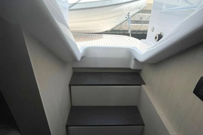  Yacht Photos Pics Staircase on 2019 Azimut Magellano 66 yacht leading to deck area.