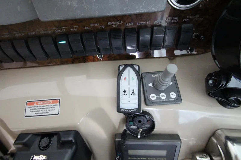  Yacht Photos Pics Control panel of a 2000 Sea Ray 410 Sundancer boat with various switches and joystick.