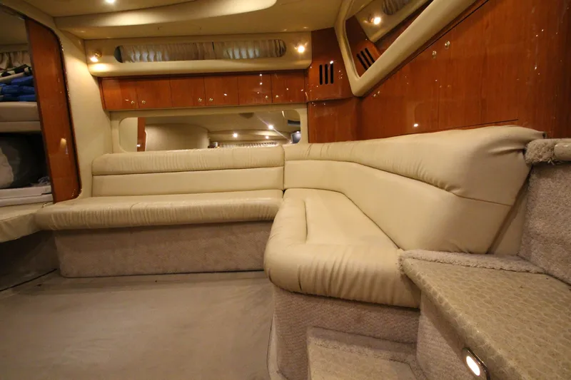  Yacht Photos Pics Luxurious interior of 2000 Sea Ray 410 Sundancer yacht with plush seating and wood accents.