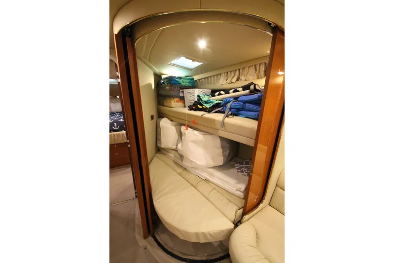  Yacht Photos Pics Interior cabin of 2000 Sea Ray 410 Sundancer with bunk beds and storage.