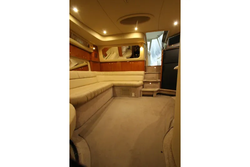  Yacht Photos Pics Luxurious interior of 2000 Sea Ray 410 Sundancer yacht with plush seating and ambient lighting.